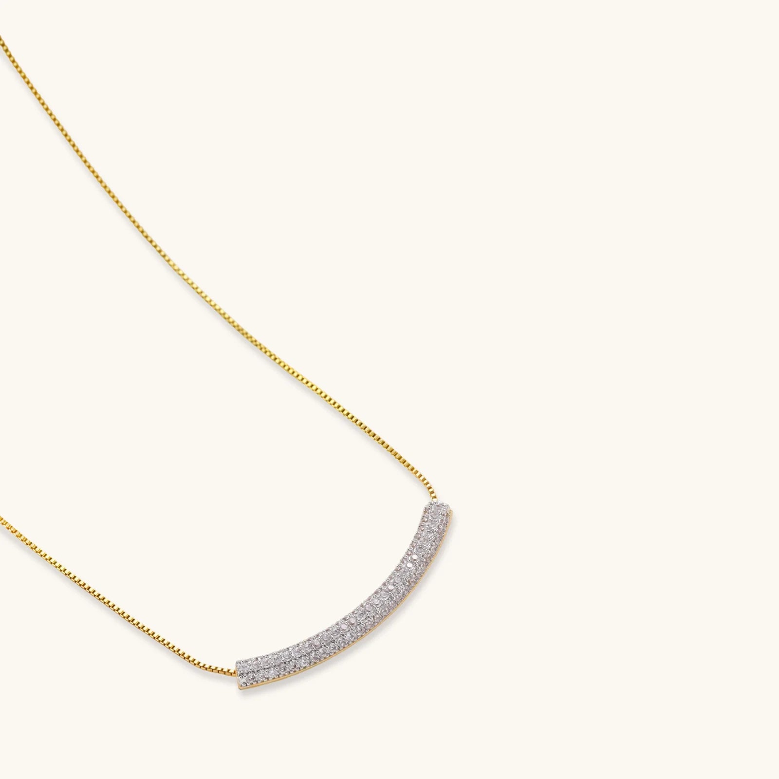 Crescent Glow Set gold pavé necklace on plain white background