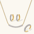 Crescent Glow Set gold pavé necklace, earrings, and ring on white background