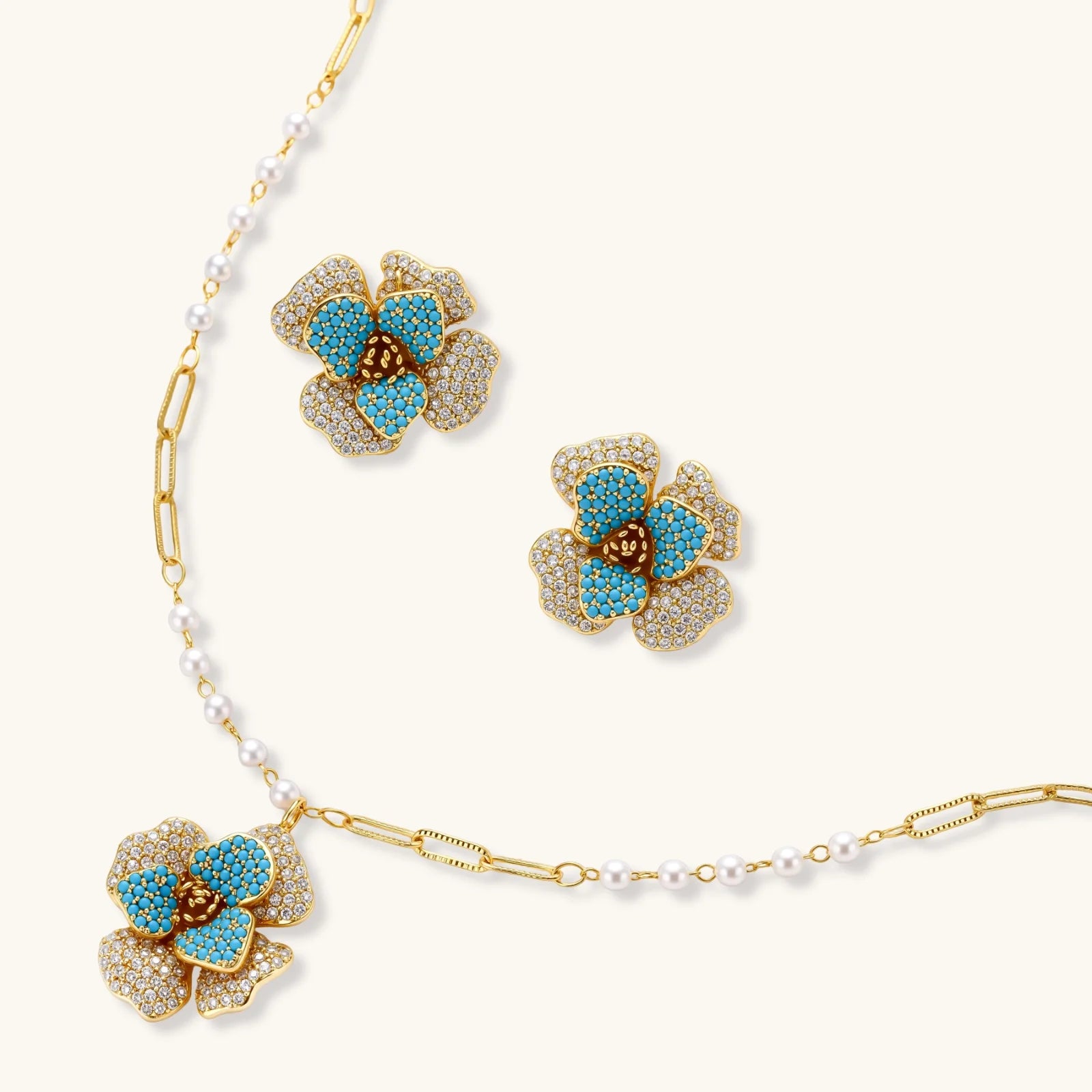 Blooming Sapphire Set gold necklace and earrings on white background