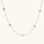Celestial Pearl Stars Necklace with star-shaped pearls on plain background
