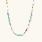 Seafoam Dreams Necklace with gold chain and green stones on white background