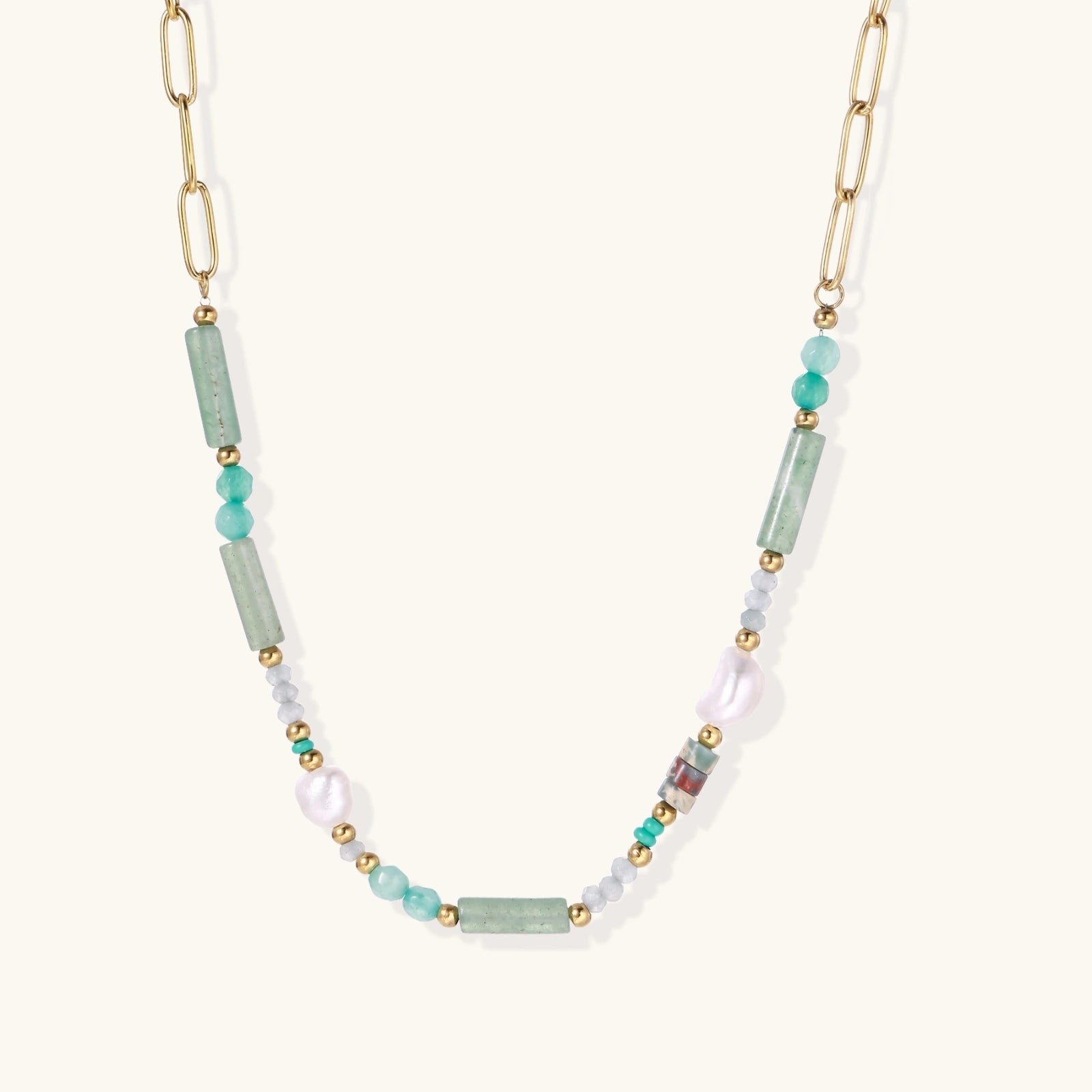 Seafoam Dreams Necklace with gold chain and green stones on white background