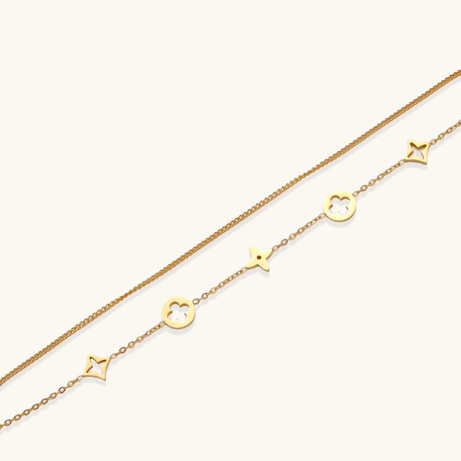 Lucky Star Charm Bracelet gold chain with star and clover charms on white background