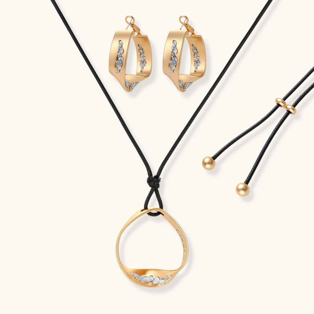 Cosmic Circle Set gold necklace and earrings on white background