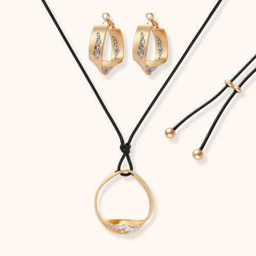 Cosmic Circle Set gold necklace and earrings on white background