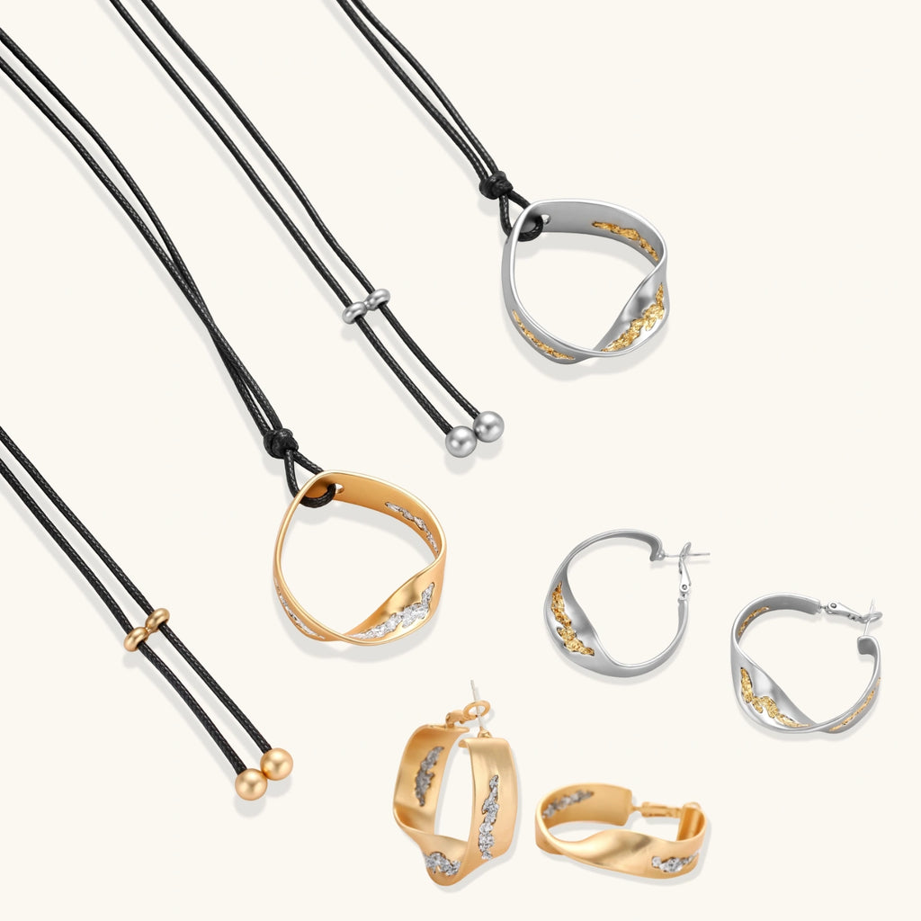 Cosmic Circle Set gold and silver necklaces and earrings on white background
