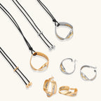 Cosmic Circle Set gold and silver necklaces and earrings on white background