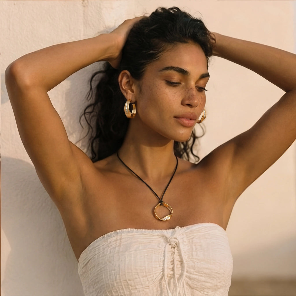 Woman wearing Cosmic Circle Set gold necklace and earrings
