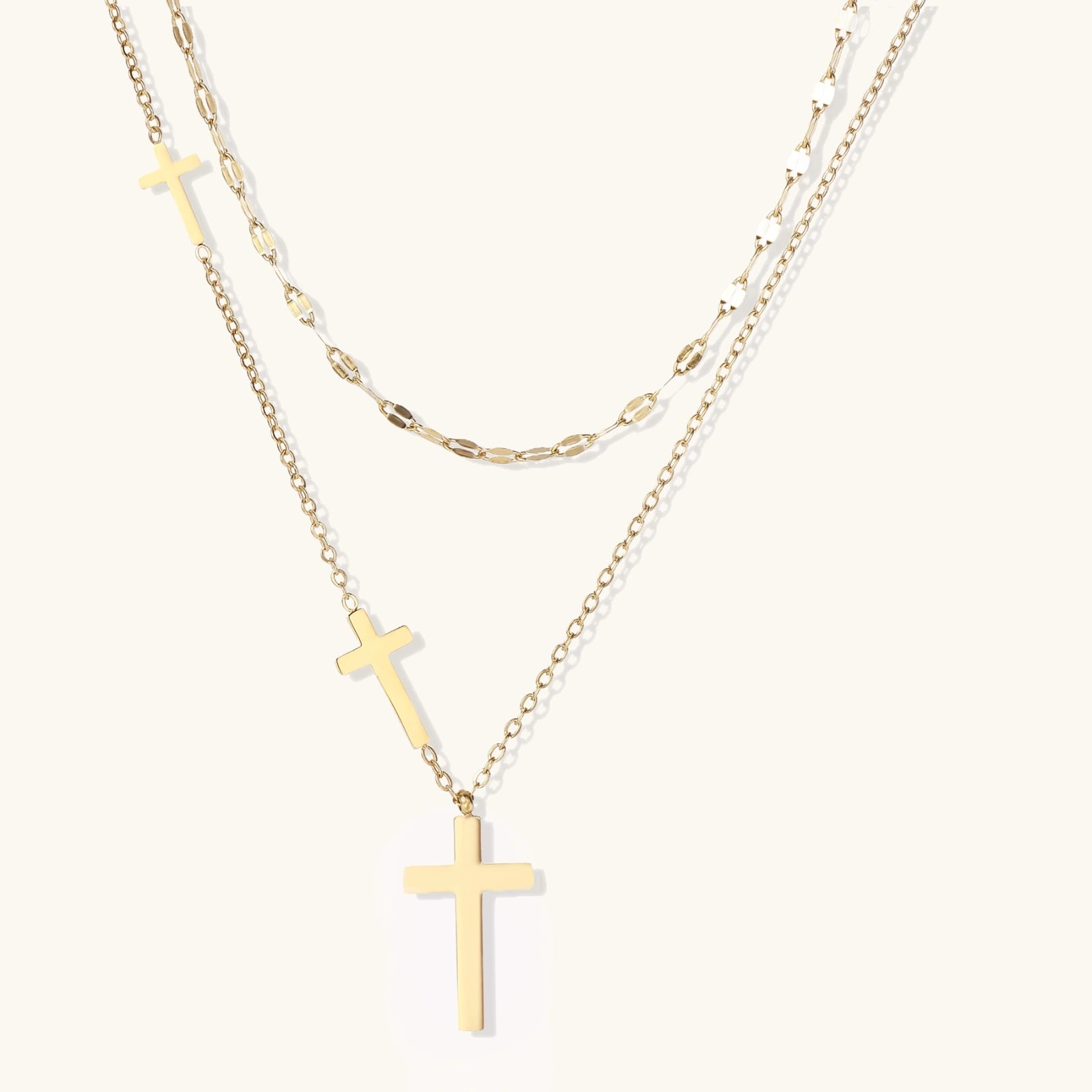 Divine Layers Cross Necklace Set gold layered necklace on white background