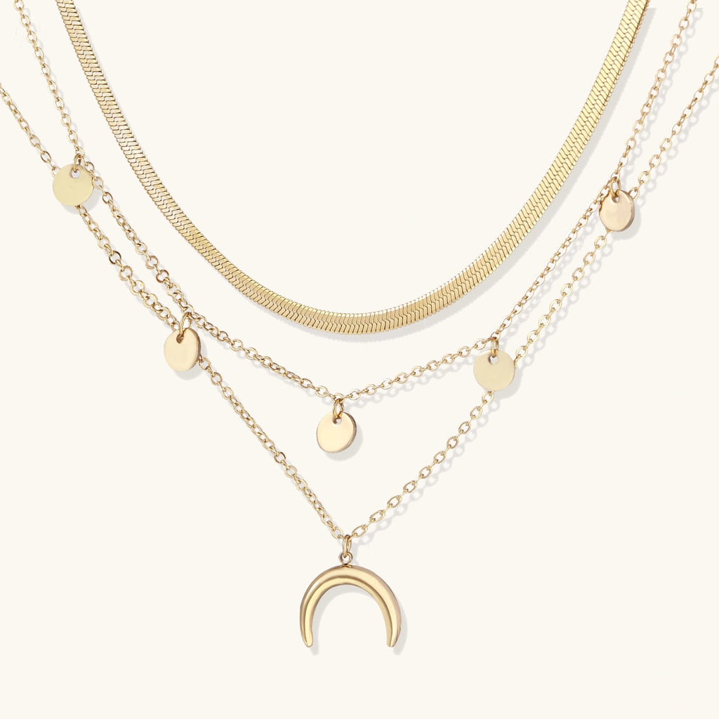 Golden Crescent Layer Set gold layered necklace with moon pendant on white background